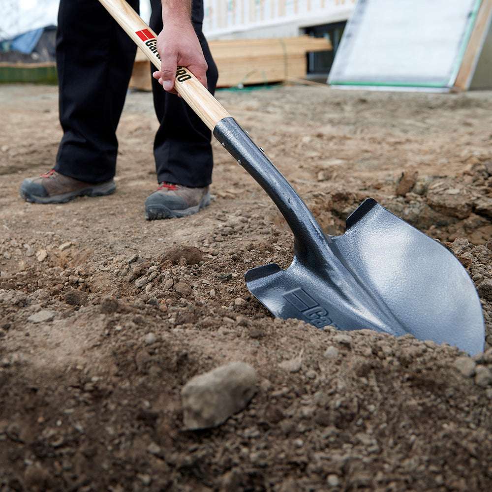 Round point shovel, long wood handle